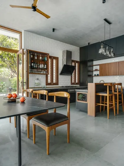 A kitchen should be both beautiful and functional, seamlessly connecting to the life of the home. This open-plan kitchen and dining area extends into the garden, blurring the line between indoor and outdoor living.