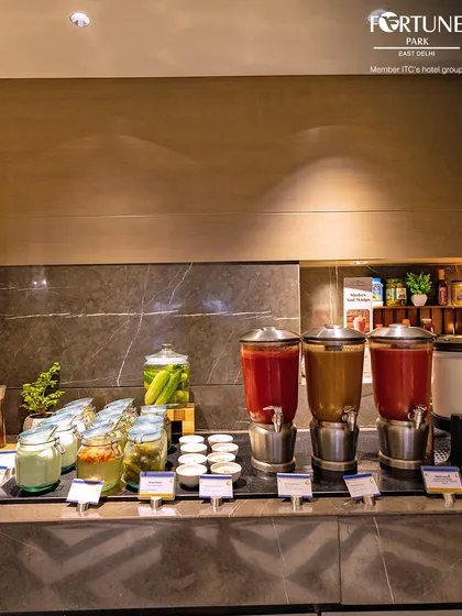 Our beverage station offers a variety of fresh juices and infused waters to quench your thirst.