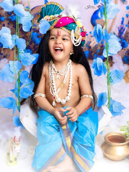 A burst of pure laughter from this little Krishna on a swing. Capturing such uninhibited joy is the ultimate goal of any child's photoshoot.