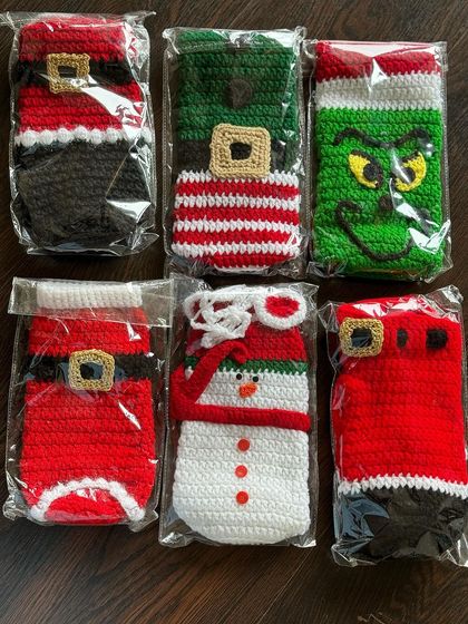 A batch of my Christmas-themed bottle covers, all packed and ready for dispatch. This order includes Santa, snowman, elf, and Grinch designs.