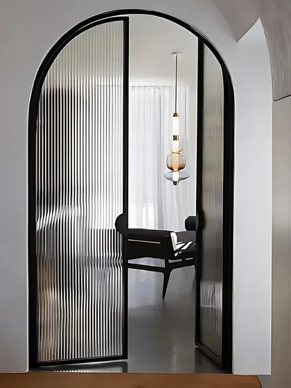 Fluted or reeded glass is a beautiful way to add texture and privacy. We love using it for doors and partitions to create a sense of separation without blocking light.