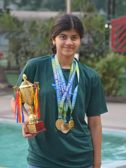 Nivedita Shah stands as a testament to our training methodology, holding her Individual Championship trophy after securing four gold medals and one silver. Her success is a reflection of her hard work and our commitment.
