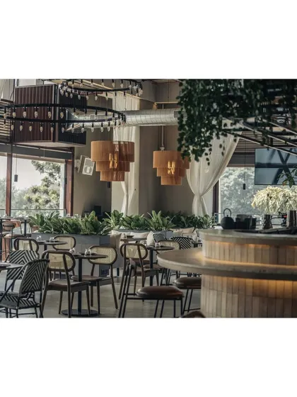 We love how the abundant greenery inside the restaurant mirrors the lush landscape visible through the windows. This seamless connection to the outdoors brings the space to life and honors Bangalore's "Garden City" reputation.