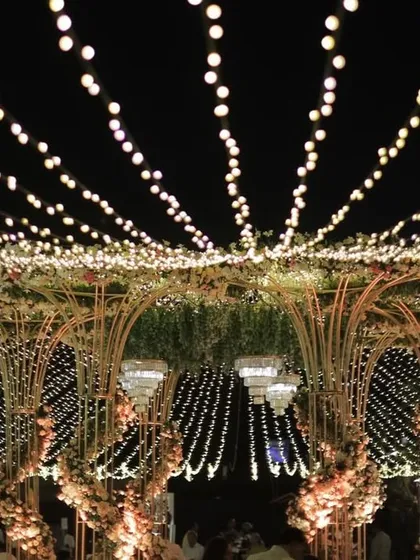 The grand mandap at night, with the fairy light canopy creating a breathtaking spectacle of light and shadow.