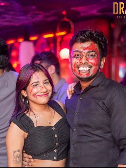 A couple with fun face paint at our Drava Halloween party.