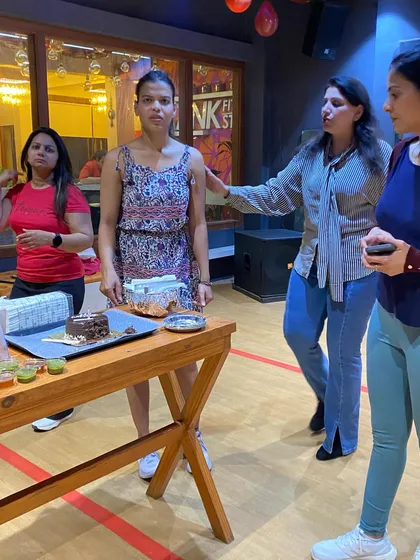 Getting the cake ready for our Women's Day celebration. It's the small things that make our community feel like family.
