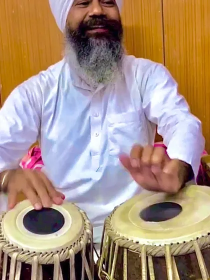 A close-up of my Ustadji playing. You can see the lifetime of dedication and knowledge in his hands. It is a blessing to learn from him.