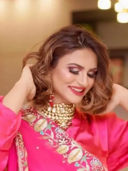 A happy client in a bright pink ethnic outfit. The look is completed with an embroidered dupatta and a statement kundan choker, showing how my designs can be styled for a festive and vibrant occasion.