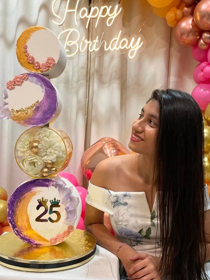 Another shot of me with my 25th birthday cake. The vertical design with different moon phases was a challenge I loved taking on.