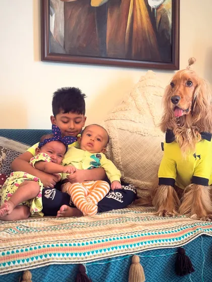 Another adorable group shot of Posto with his human cousins. He truly is the center of their world.