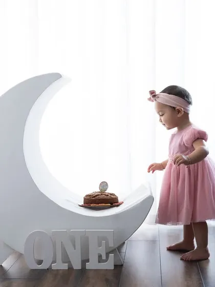 I love bringing whimsical ideas to life in the studio. This "over the moon" theme for a first birthday is a perfect example of a sweet and imaginative setup.