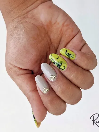 Another pose showing the acrylic extensions with swirl art.