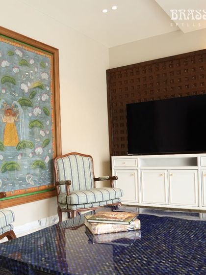 A wider living room view, where the small golden Sphere knobs on the console add a subtle, unifying metallic accent to the space.