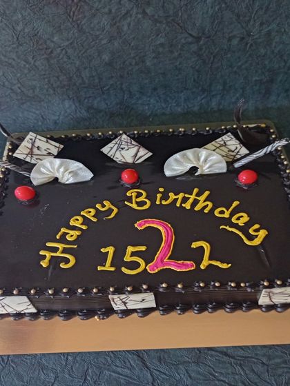 A large chocolate sheet cake for a big celebration. This cake is perfect for corporate events or large parties, like this one for The 1522 Pub's anniversary.
