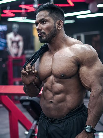 Hood life. A relaxed but powerful pose, showing the physique that comes from a dedicated lifestyle.