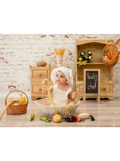 This little chef is having a great time with his pasta. These themed shoots are all about letting kids play and explore, which is how I capture such genuine moments.