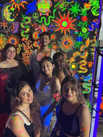 Getting ready for the Full Moon Party the right way. Our crew getting painted with neon colors before heading out to dance the night away. It's a tradition and the perfect way to get into the party spirit.