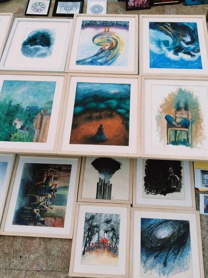 A collection of Nazia Rushdi's conceptual artworks, laid out for viewing. Her pieces have been exhibited in numerous prestigious shows, and we are proud to showcase her talent.