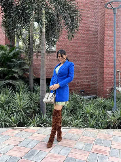 My styling isn't just about Indian wear. I create bold, confident western looks too. Here, I paired a sharp royal blue blazer with a short dress and statement leopard-print thigh-high boots for a powerful, fashion-forward OOTD.