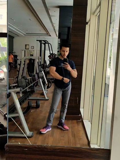 A quick post-workout selfie. Even when I'm not in gym clothes, the results of consistent training are visible.