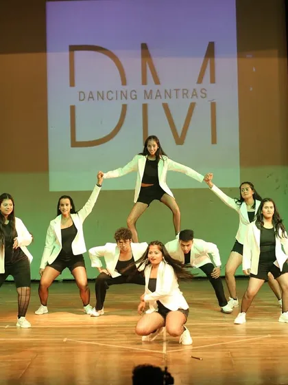 A dynamic formation from one of our high-energy hip-hop routines. This image shows the strength and teamwork of our dancers as they create a human pyramid, a true show-stopping moment.