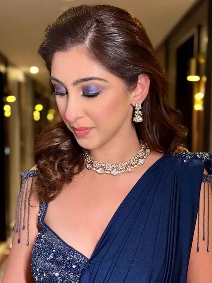 The full effect of Nisha's dramatic blue eye makeup. It’s a perfect example of how to do a bold, colorful look for an evening event while still looking elegant.