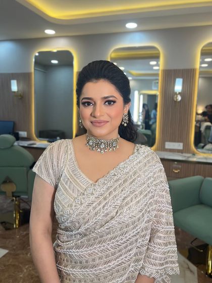 This client looks so poised and beautiful. The elegant makeup enhances her features without overpowering them.