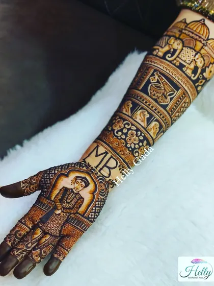 The groom's portrait extends up the arm, complemented by bands of traditional patterns. This view shows how the entire design flows together cohesively from the palm to the elbow.
