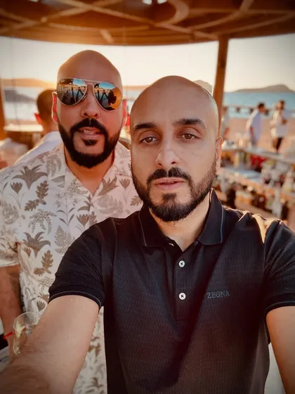 A selfie with my Kudos DJ partner in Greece. The golden hour vibes were perfect for the beachside welcome party.