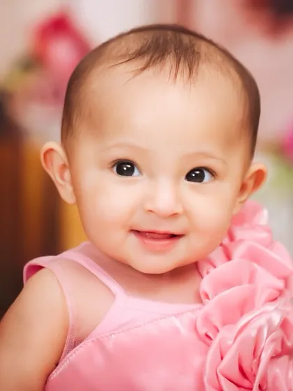 A sweet and simple close-up portrait of a baby girl. I focus on capturing their delicate features and innocent expressions during these sitter sessions.