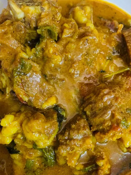 You can see the rich texture of the masala beef curry in this close-up shot.