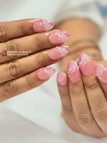 Another angle of the pink and white swirl design, showing the subtle glitter and the delicate line work.