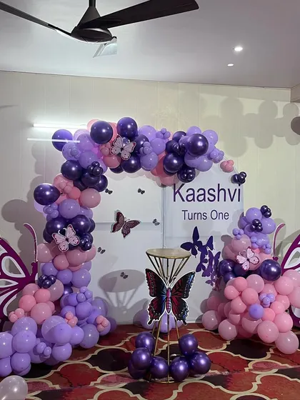 Another perspective of the butterfly wing balloon decoration, showcasing the depth and dimension of the balloon arrangement.
