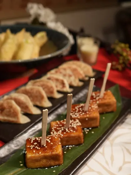 A focused look at our Agedashi Tofu and Gyoza, two appetizer staples that are always a hit at parties. The tofu is lightly fried and served in a warm broth, while the gyoza are pan-seared to perfection.