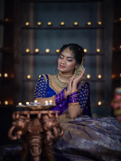 A shot from our Diwali-themed shoot, with the model surrounded by the warm glow of diyas.