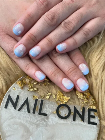 A dreamy and whimsical design featuring a soft blue and white ombré base that mimics a cloudy sky. We added tiny white stars for a magical touch.