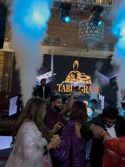The Tablagram logo on the big screen while guests enjoy the party. I ensure a professional and branded entertainment experience.