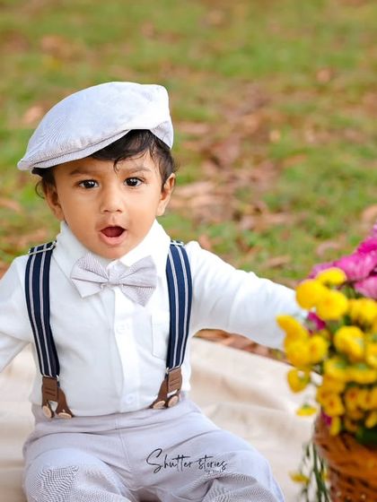 A surprised and adorable expression from the little guy in his dapper outfit.
