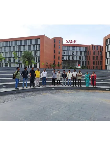 My team and I on-site at the completed amphitheater of Sage University, a central gathering space for students and faculty.