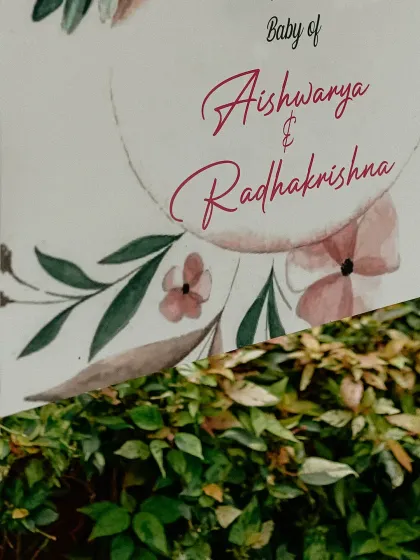 An artistic shot of the naming ceremony welcome sign, highlighting the names of the proud parents.