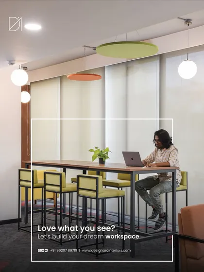 Modern work requires flexible solutions. This high-top collaborative table provides an alternative to traditional desks, encouraging casual meetings and focused individual work in a bright, open setting. It’s a perfect example of how we design for different work styles within a single office.