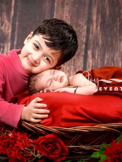 There is nothing more special than the bond between siblings. We capture these tender connections, like an older brother lovingly watching over his newborn sibling, creating a timeless family portrait you will treasure for years.