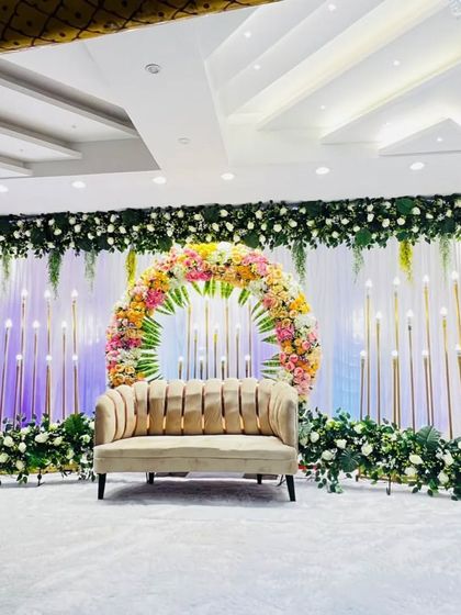 A circular floral arch stage design at Grand Utsav banquet in Kharghar. This is a very popular and photogenic setup for modern weddings and engagements.
