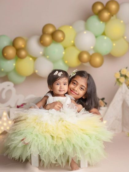 A repeat of the beautiful image 18, showing the tender hug between an older sister and her baby sibling, a perfect example of the love I aim to capture.