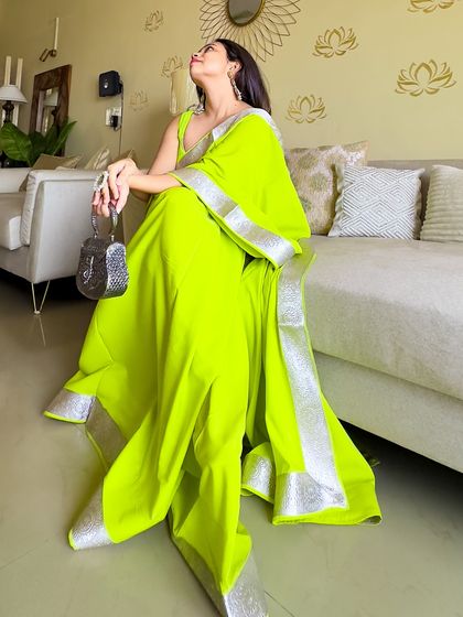 Looking up, dreaming in neon. This custom-designed saree is proof that you should always wear the colors that make you feel amazing, regardless of trends.