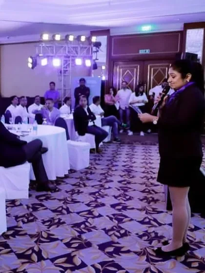 Interacting with the audience during the Reliance General Insurance event.