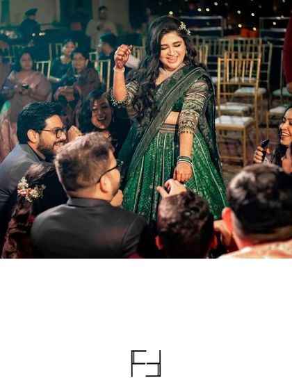 A fun moment from the Sangeet night, with the bride playing games with her guests. It’s these interactive and joyful moments that make for unforgettable memories.