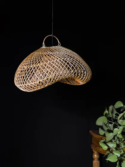 Inspired by the flowing forms found in nature, this sculptural rattan pendant is a true statement piece. Its unconventional, wavy shape is designed to be captivating from every angle, whether the light is on or off.