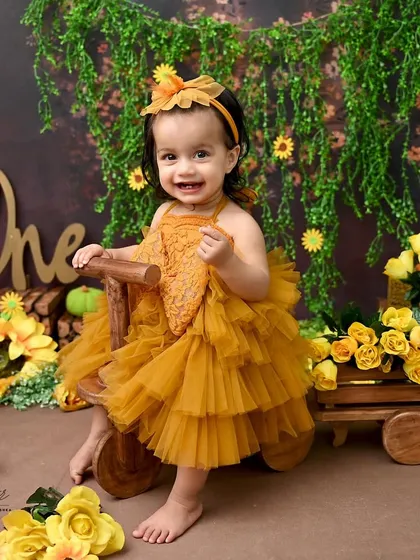 Sunshine and sunflowers for this happy sitter session. At this age, when babies can sit up on their own, their personalities truly shine. This bright and cheerful setup captures that wonderful, curious stage.