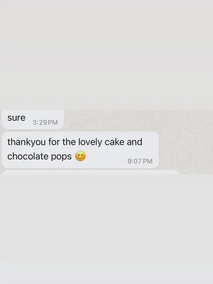 "Thankyou for the lovely cake and chocolate pops." A happy client review for the cat-themed cake and treats.